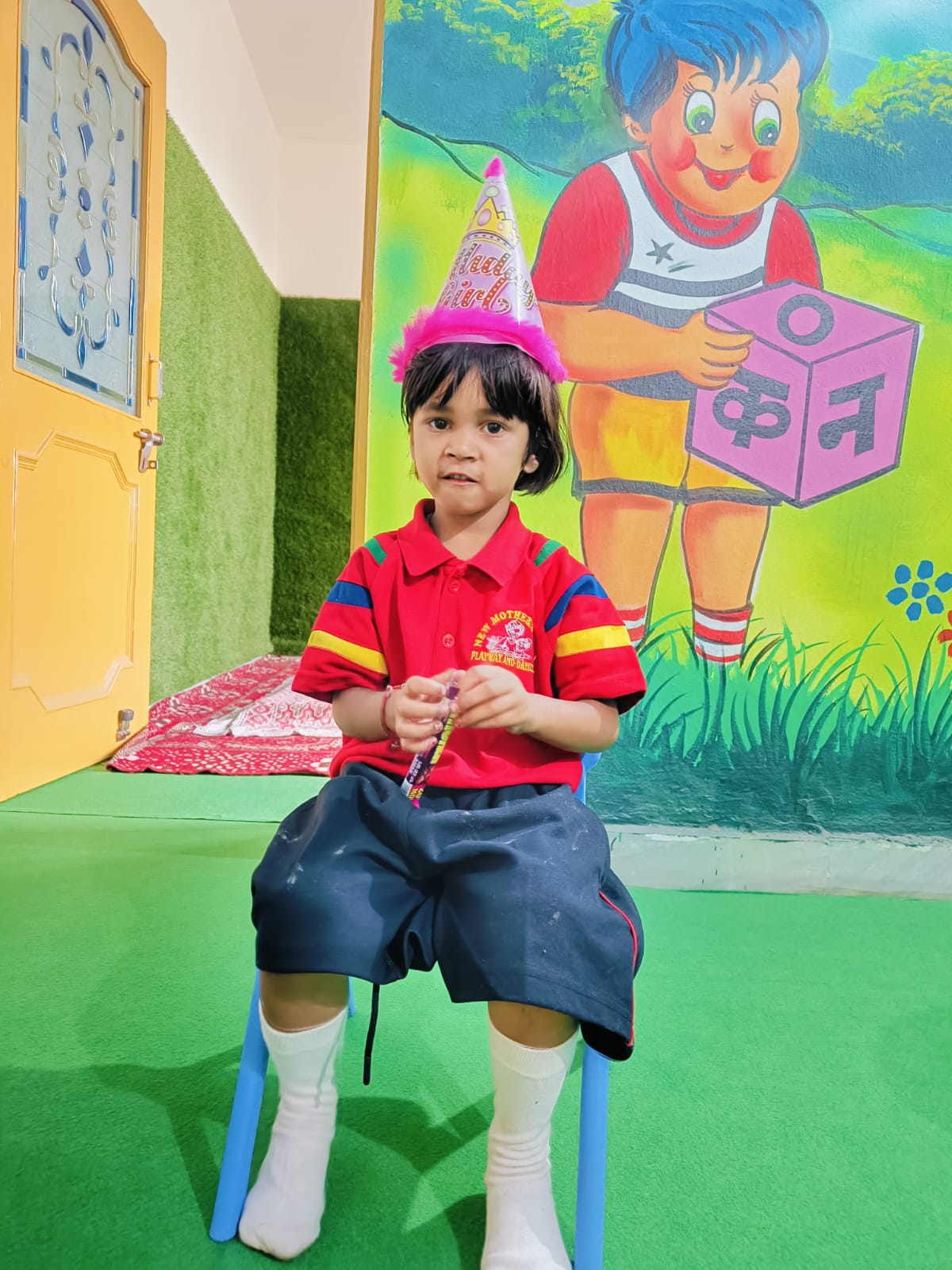 A child resting comfortably in a cheerful daycare corner