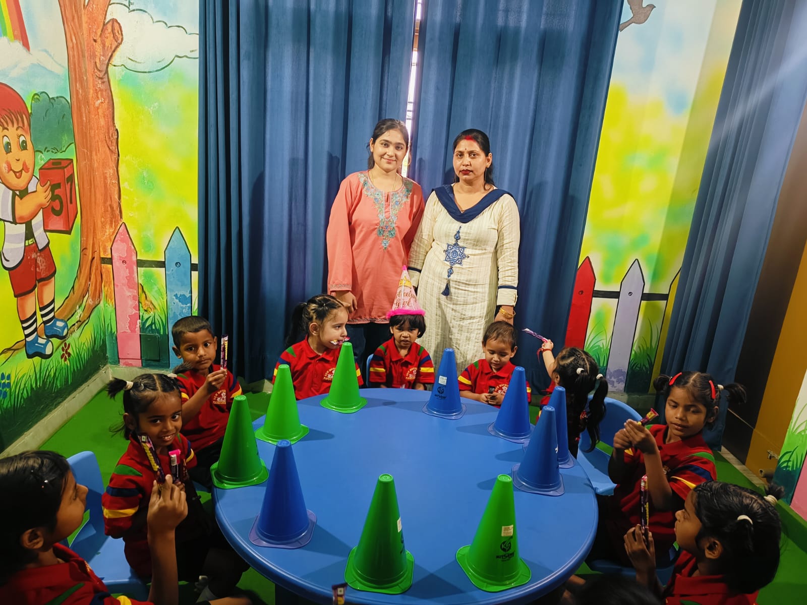 Teachers spending time with children during a classroom activity